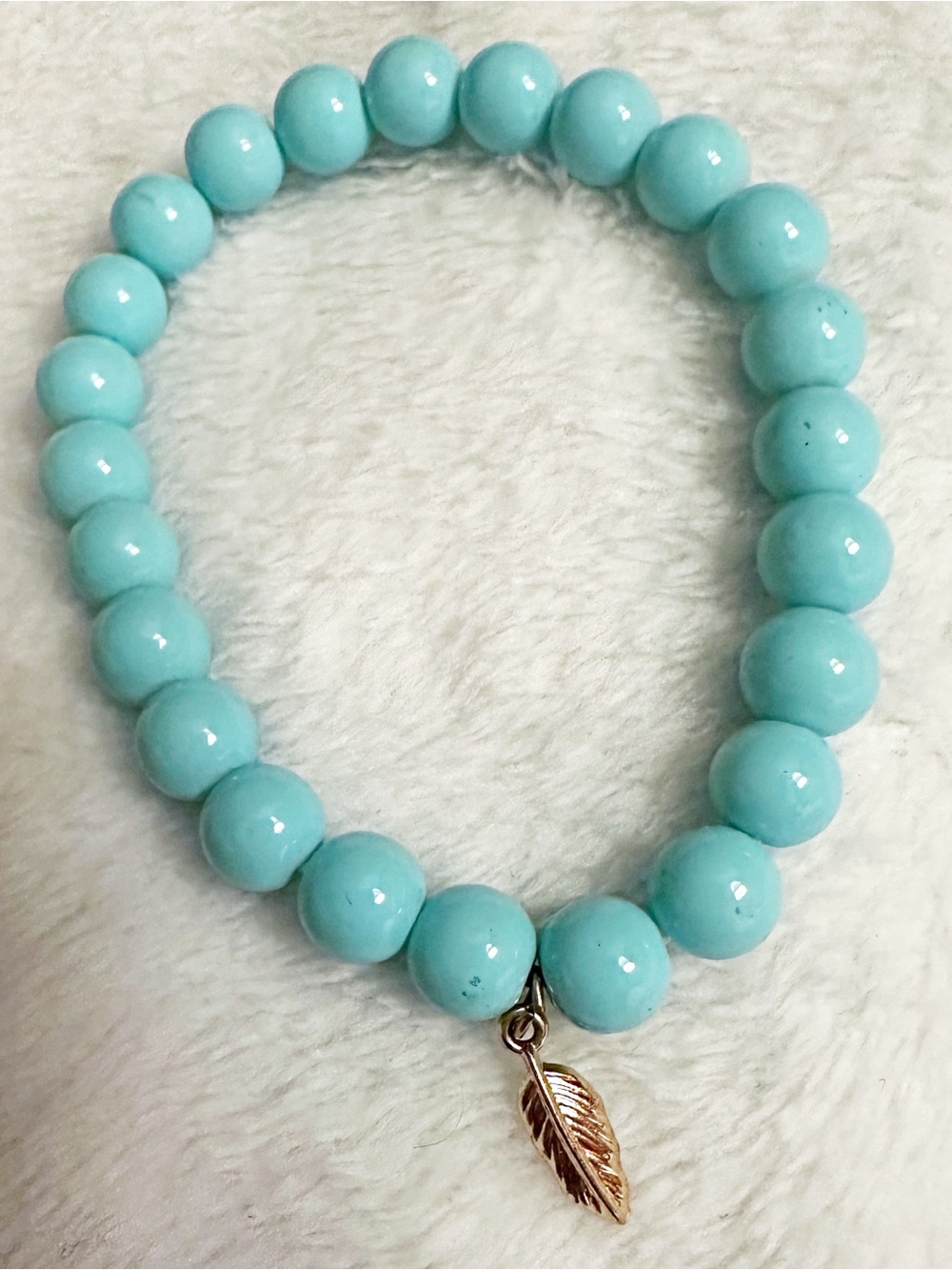Turquoise Beaded Stretch Bracelet with Gold Feather Charm